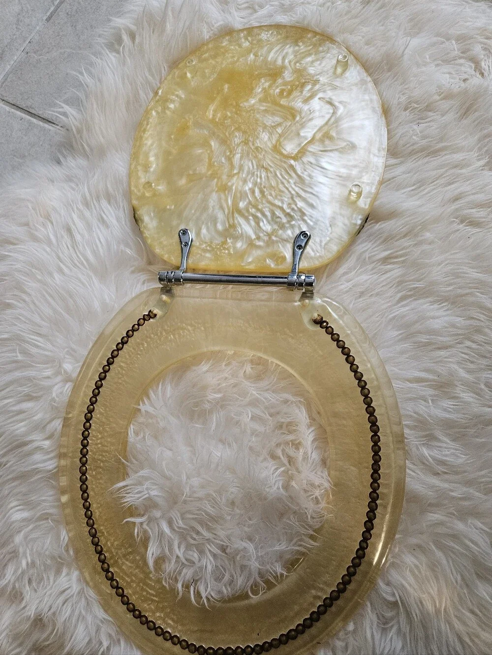Vintage-Inspired Cream Toilet Seat Round with Decorative Hinge Accent Elegant.
